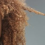 mixed race black woman with neutral makeup portrait