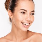 Beauty portrait of a happy woman with skincare
